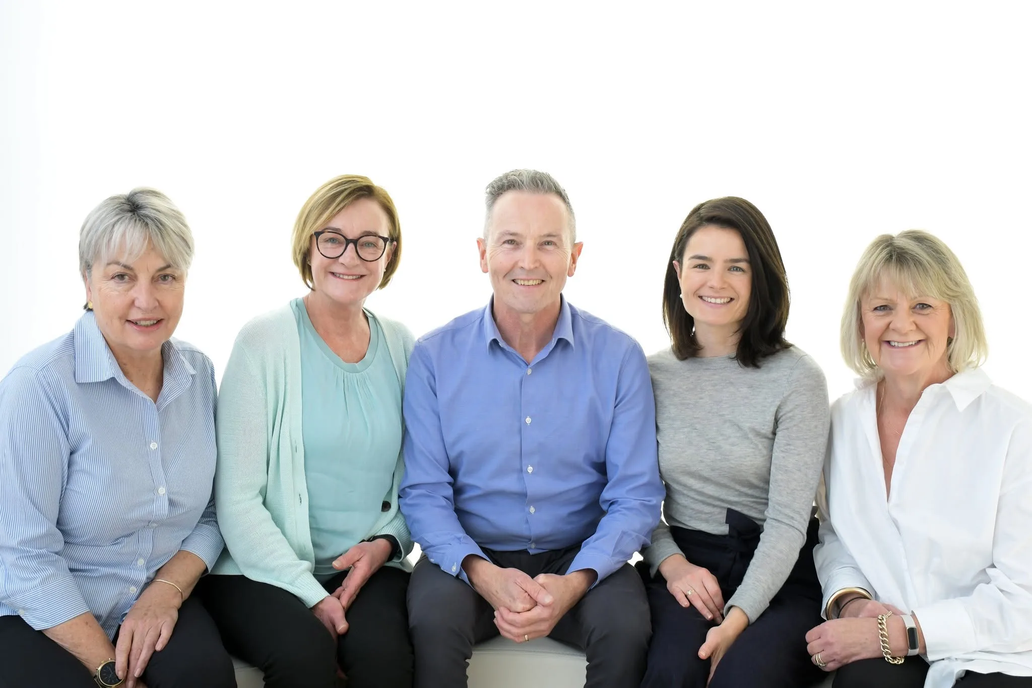 The Hartwell Chiropractic Centre team — Dr Mark Navin, Dr Sophia Navin and the reception team